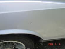 small dent in the rear passenger side fender