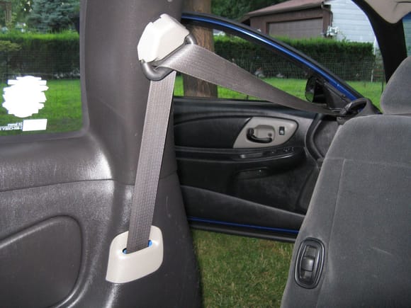 Old rear interior from 2011.  Original black panels with the gray seat belt trim and upper seat belt piece.