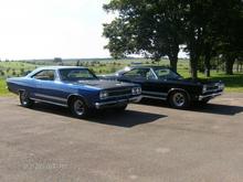 Father &amp; son. The black one is pops mint rotisserie , 68 GTX ,
peacock blue stripes and the blue one is my 20 footer.
Both are drivers.
