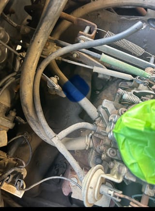 Here is the back of the car showing 2 vacuum lines.  The one with the blue dot goes to the PCV valve. 