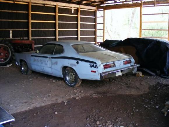 my duster and my dads 69 charger r/t covered up in the back