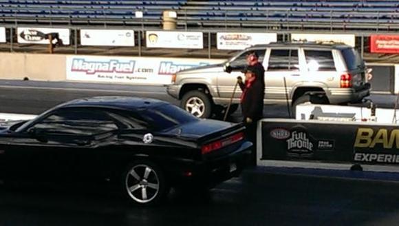 what! Lifted Jeep station wagon playing at the track