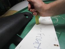 Flattening hole surrounds with butt end of screwdriver