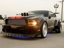 Knight Rider Mustang with a lot of Muscle? One way ticket ride hello don't think so! This Stangs not so hot  looking has some nice side vents,and a wing ,maybe knows some tricks but honey that smile looks cheap!