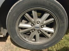 minor damage to front rim from curb checking