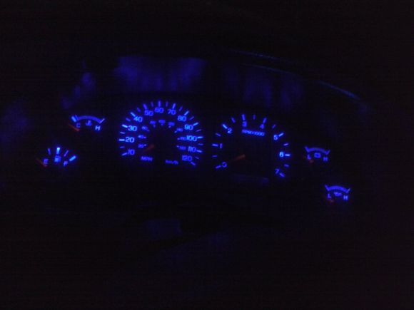 Upgraded gauge cluster bulbs with T5 blue LEDs. I also upgraded HVAC and shift assembly with T10 blue LEDs