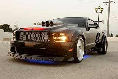 Knight Rider Mustang with a lot of Muscle? One way ticket ride hello don't think so! This Stangs not so hot  looking has some nice side vents,and a wing ,maybe knows some tricks but honey that smile looks cheap!