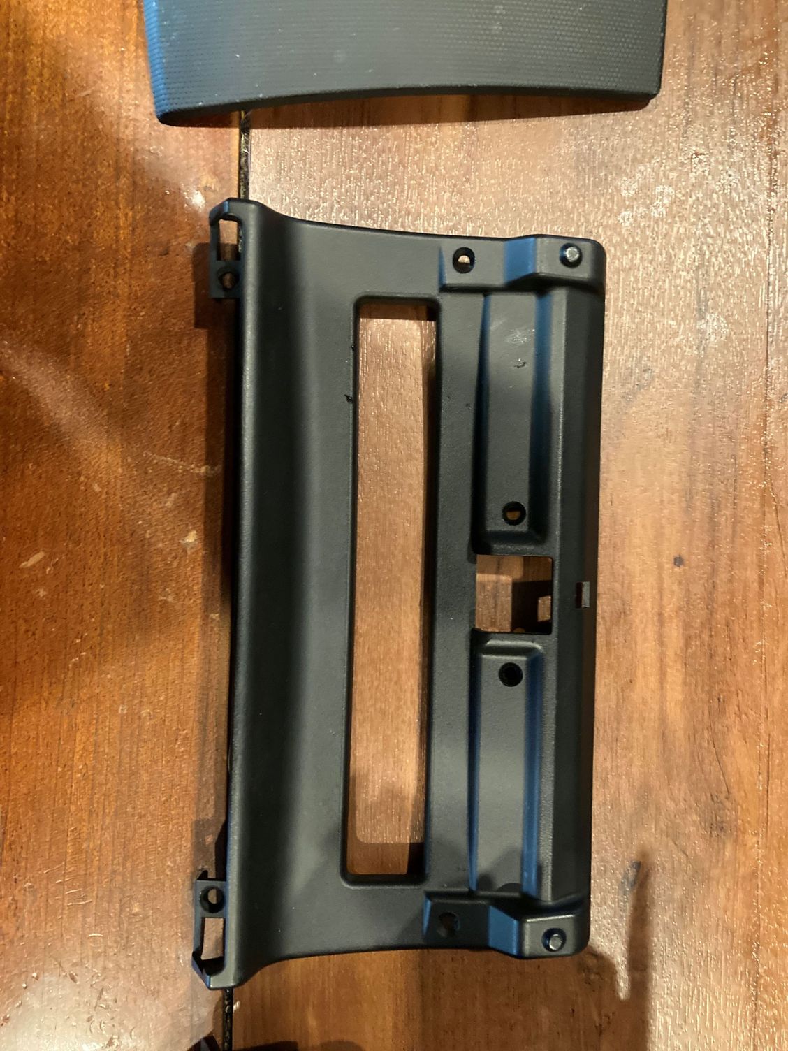 Piece that attaches to back of door.  Have to remove to get the latch out.