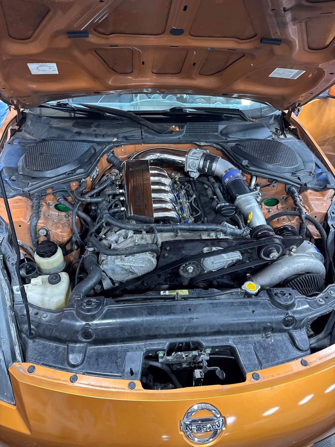 Engine bay, also have headers, cat back exhaust with titanium tips, and more.