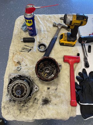 Casing separated, rotor with front case. Note: I removed the pulley 1st, but the rust kept the rotor with the front casing during separation.