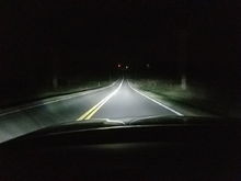 LED Headlights on rural road.