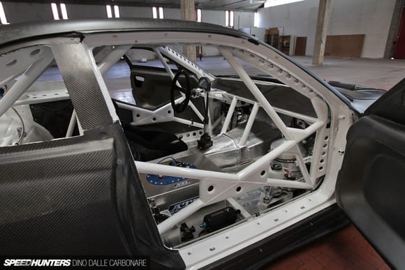 Virtually zero dash, I like the bars down to the tunnel and would have a small kit car heater box in there.

My car is / was fully trimmed but if I am going big cage I wonder if I might do something more like this?