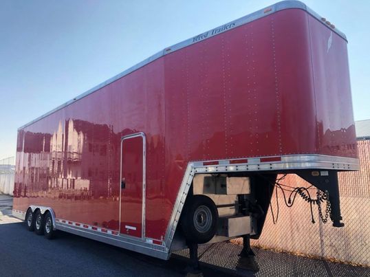 2000 Kenworth T2000 and 2002 Featherlite Aluminum Stacker Tr for Sale $95,000
