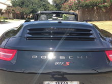 i found this photo of a 991 with modified badging with the 'Carrera' removed.  it was done by the dealer so the kerning and spacing is done correctly (oem quality $450 dealer job).  i based my '911S' badging job based on this oem template.  the width of the '911S' should reside underneath (and not cross) the R and the C above.  the overall width of the '911S' should be slightly under 4+3/4" inches.