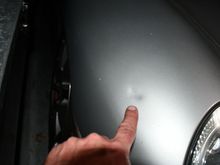 Ding behind passenger headlight.  Young son of former owner knocked over the stock exhaust that was leaning against the wall. (Dad’s fault, obviously!)