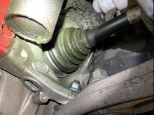 Left front CV joint boot- grease splatter.