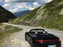 The rental, half naked, resting after going over the St. Bernhard pass between Italy and Switzerland. A must drive for people nearby. 