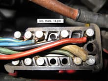 This is the upper half of the 14 pin connector with the top cover removed.
 Note the fat yellow wire, #14
 this is the furthest forward and the closest to the right fender