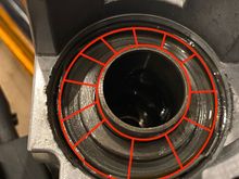 The plate that need to be compressed down with a press and the center tube you need to stay clear of. 
