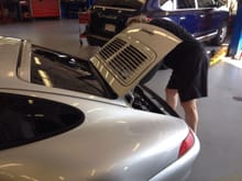 Day five at European Performance Engineering in Natick. That's Jerry installing the OEM split grille back on the car