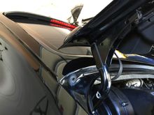 The basket handle is attached to the decklid by two bolts with 10mm nuts.