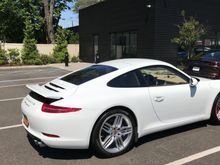  Here is a view of the car in the lot after a test drive.Sorry about the upward deployed spoiler. I did that because it was 91 degrees and I did not want to overheat the engine. LOL I am sure it doesn't matter.