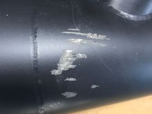 Damage on back side of exhaust