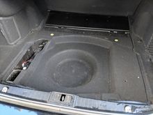 Trunk hidden compartment under floor