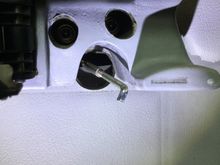 Door card still attached with big hole for the pull rod.