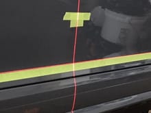 Used a Bosch laser alignment unit from home Depot to mark center point of stripe and horizontal alignment line