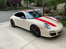 Side mirrors are coated with Plasti dip. 911 R vinyl stripe kit.