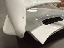 Chip on top of wing-end (passenger side)