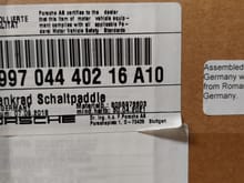 Box label from Porsche factory paddle shift steering wheel in black