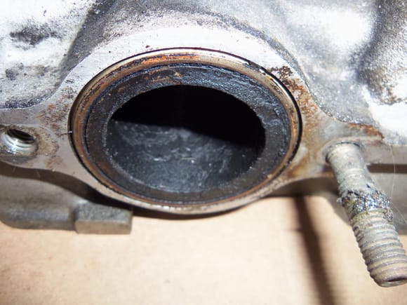 Oily sheen in exhaust port in other head, as well as one missing exhaust manifold stud.