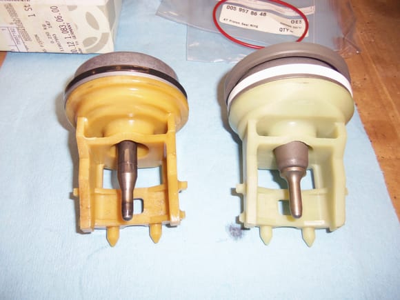 Old piston in its guide on the left, new on the right.