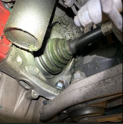 Left front CV joint boot- grease splatter.