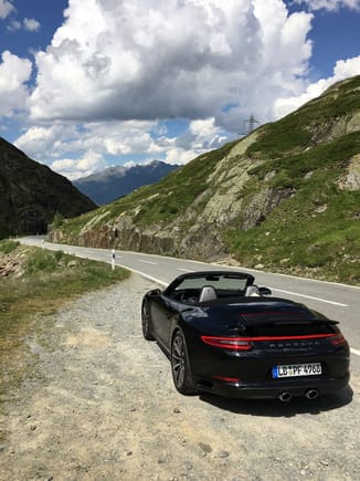 The rental, half naked, resting after going over the St. Bernhard pass between Italy and Switzerland. A must drive for people nearby. 