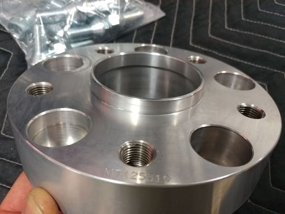 Angle view of hub-centric mounting flange and 10 spacer mounting holes (5 mount the spacer to the wheel hub and 5 are used to mount the wheel to the spacer.)