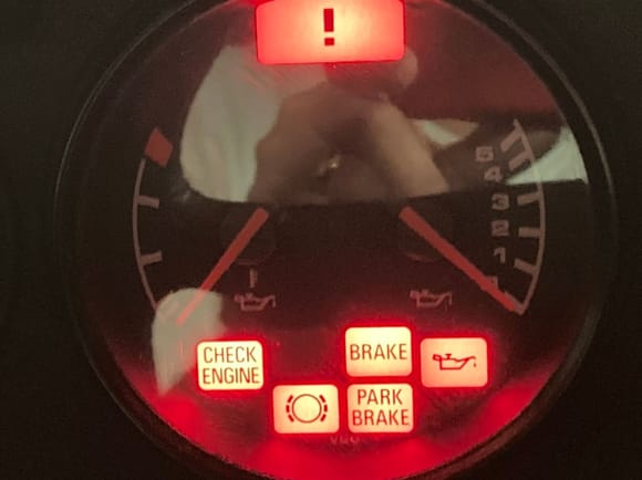 Comes on when ignition key is turned on to position 2, goes off when engine starts position 3.