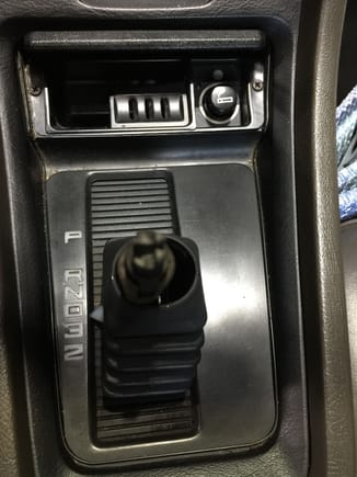 Remove shifter knob, rubber boot.
