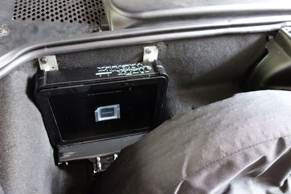 And the amplifier in the trunk. I had to build a little frame using the old CD-player frame and some metal stock. I later put black electrical tape over the shiny metal so that it blends in better.