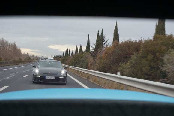 You really see the rear spoiler out the back window—this is taken at head height and you do see it in the rearview mirror, unlike a regular 991.2 Carrera coupe. 