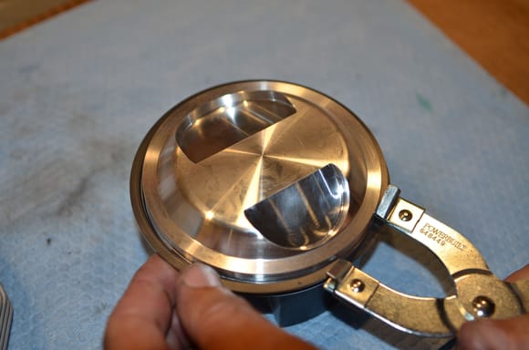 Fitting the sized rings onto the pistons...