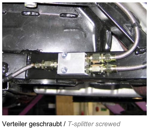 The included splitter for the hydraulic lines that I mounted near the front sway bar (picture is from the manual, obviously not a 964)

