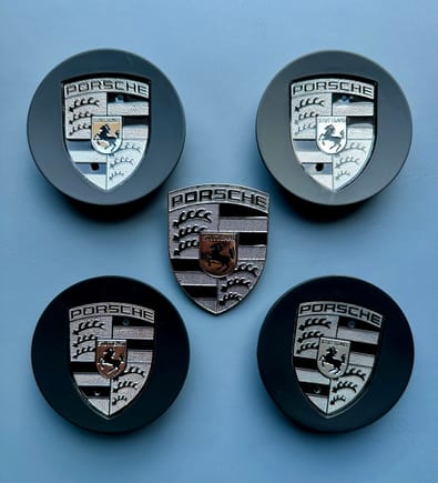 Matte black caps, monochrome emblems