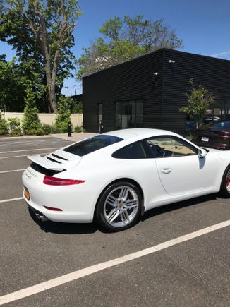  Here is a view of the car in the lot after a test drive.Sorry about the upward deployed spoiler. I did that because it was 91 degrees and I did not want to overheat the engine. LOL I am sure it doesn't matter.