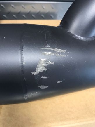 Damage on back side of exhaust