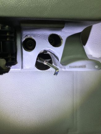 Door card still attached with big hole for the pull rod.