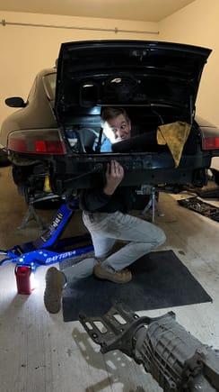 Goofy photo of me being a dork courtesy of my girlfriend. And yes I am wearing slippers. The garage floor is cold already and those bad boys keep my feet comfy and warm. The oil stains have relegated them to only garage duty now. 