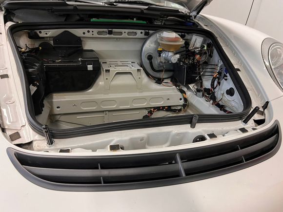 Spring popper right of center, and the two hood pins installed